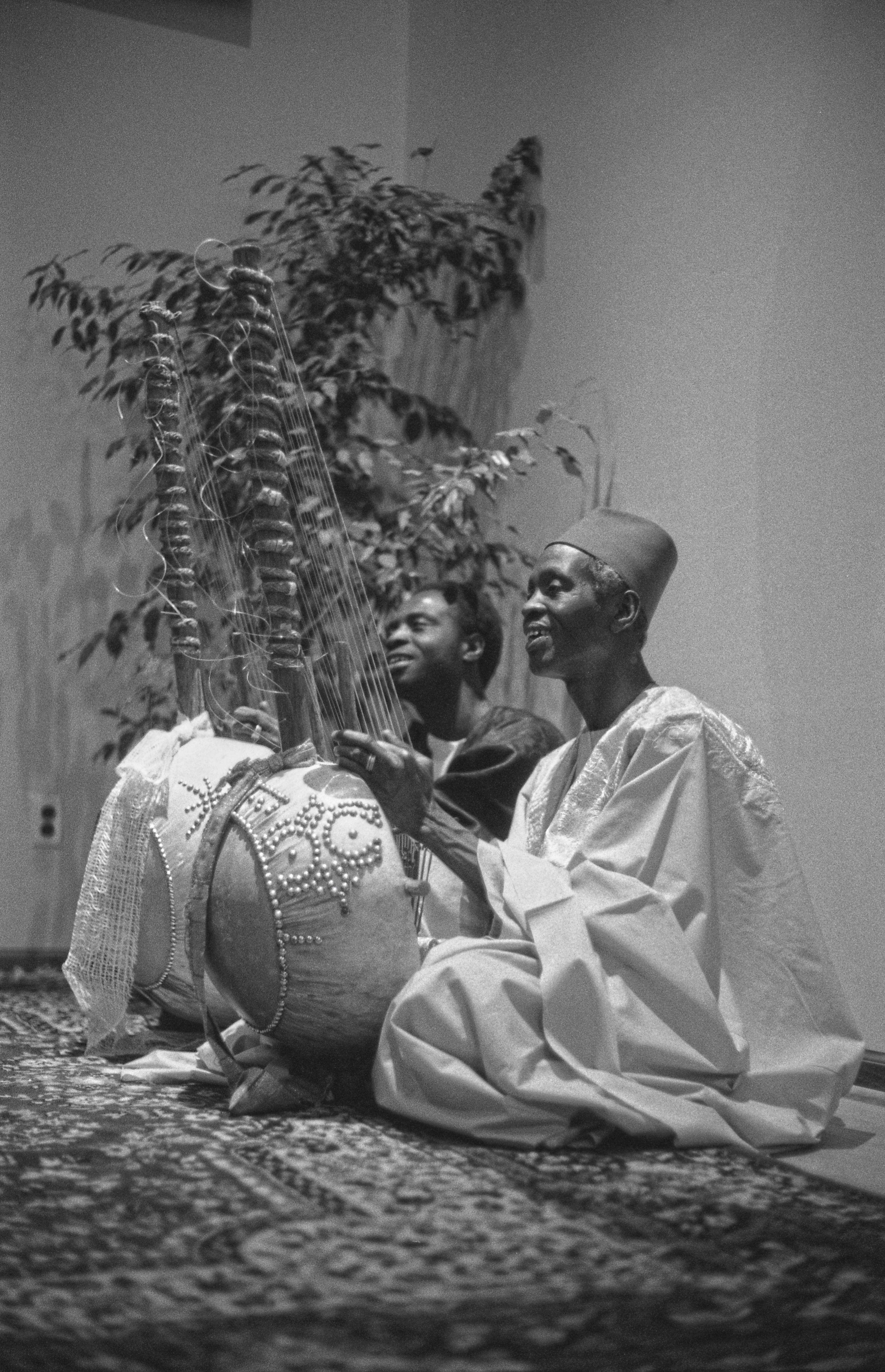 Dembo_Konte__left__and_Alhaji_Bai_Konte__right__playing_kora__photo_by_Marc_Pevar